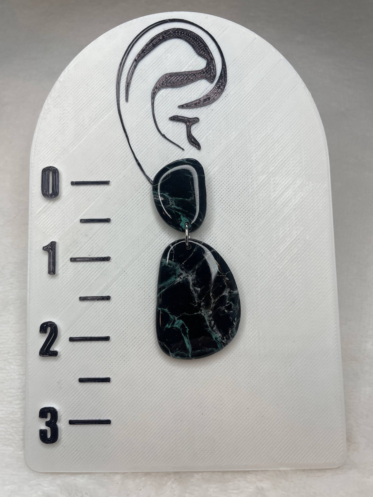 Black, white, and blue marble dangles