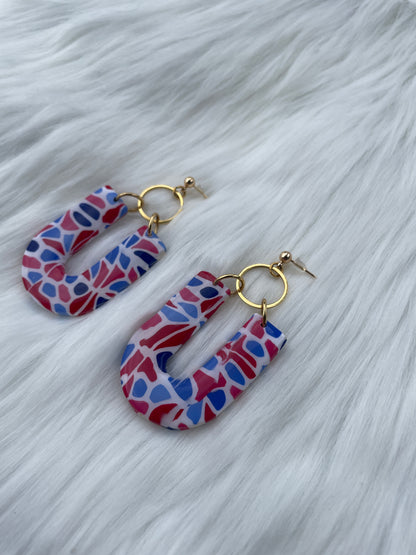 Red, white, and blue u shaped dangles