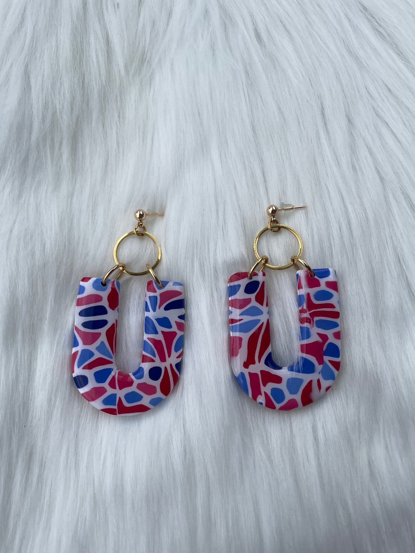 Red, white, and blue u shaped dangles