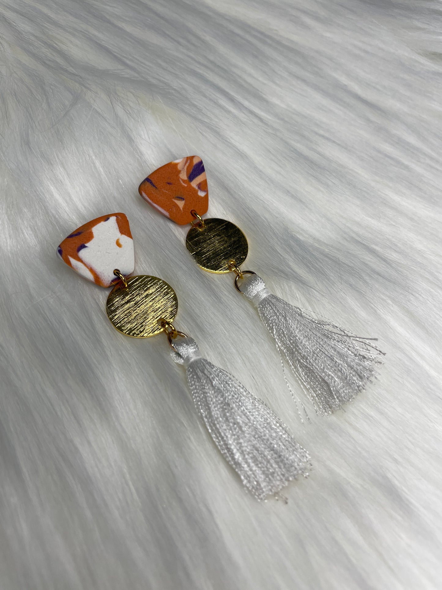 Orange, purple, and white dangles with tassel