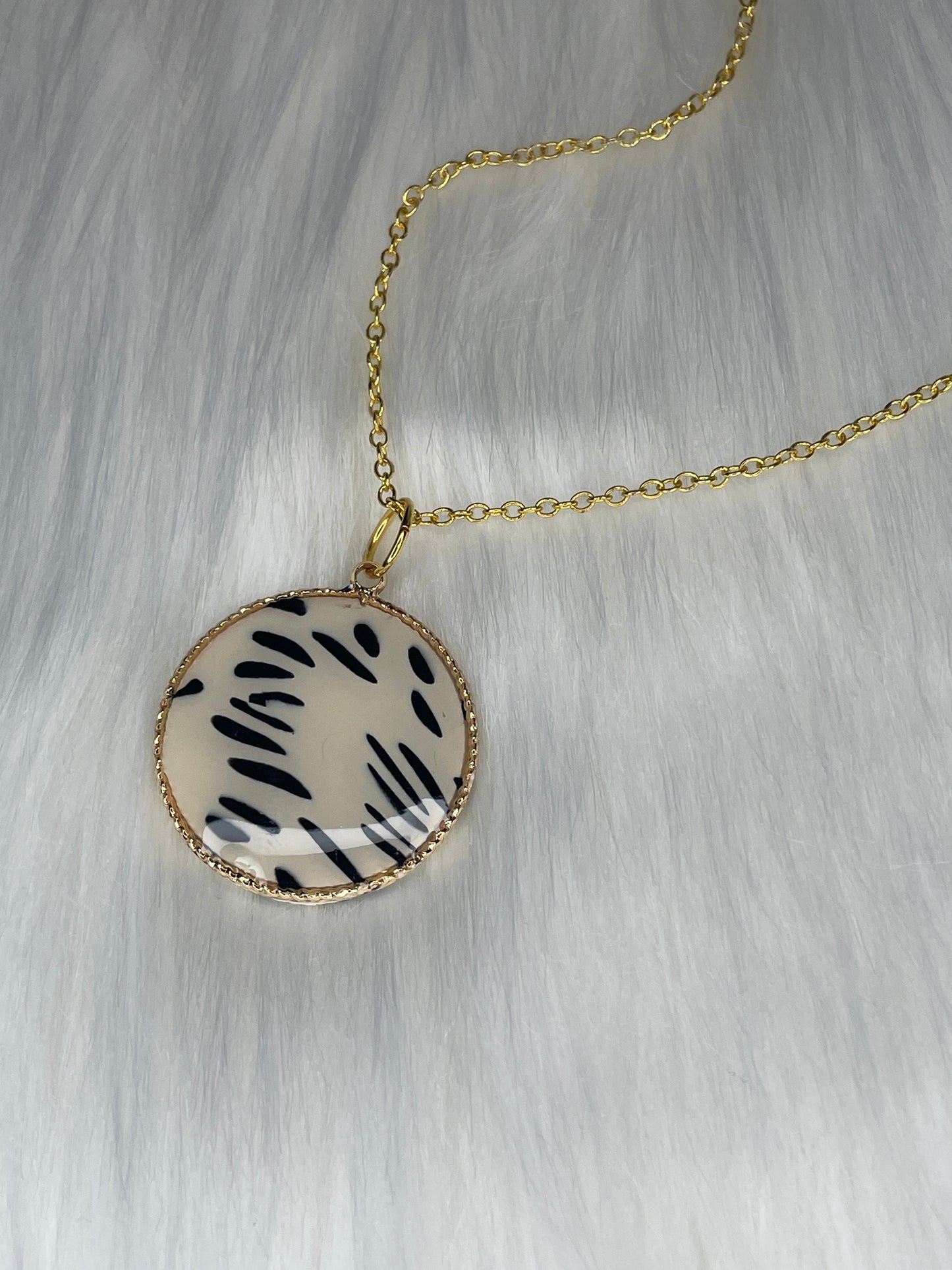 Round Dalmatian print charm necklace