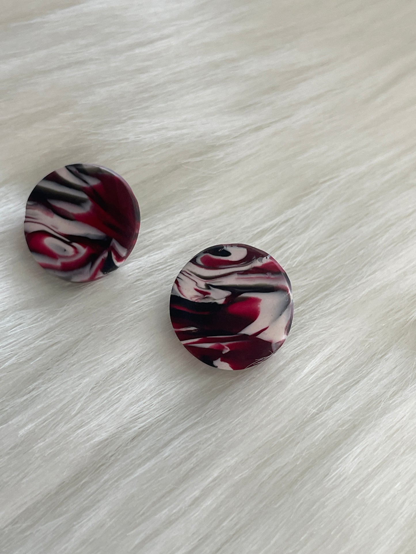 Black, garnet, & white swirled studs