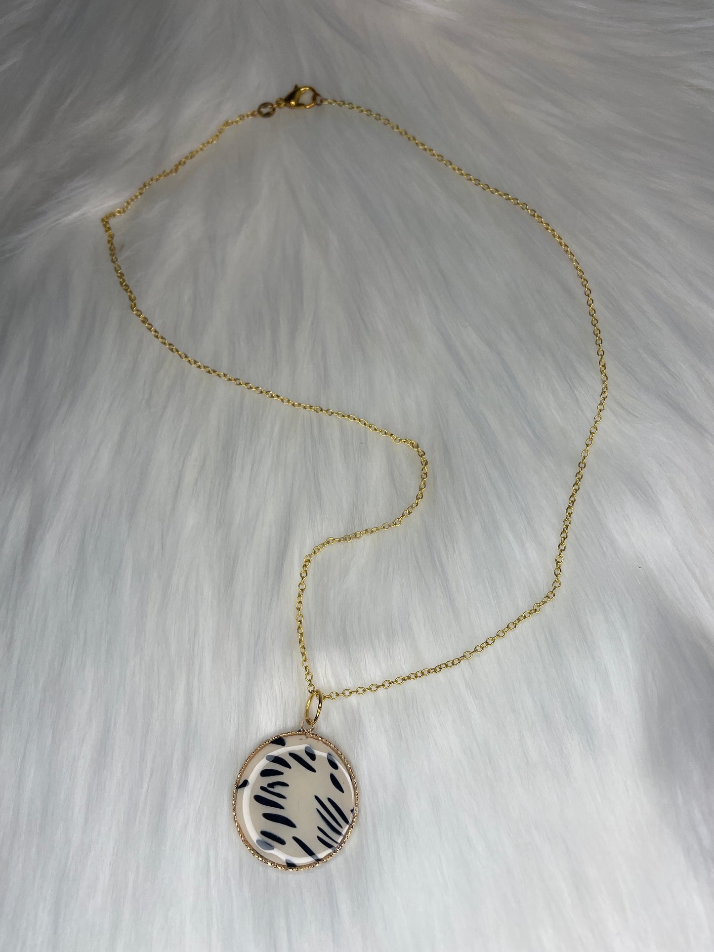 Round Dalmatian print charm necklace